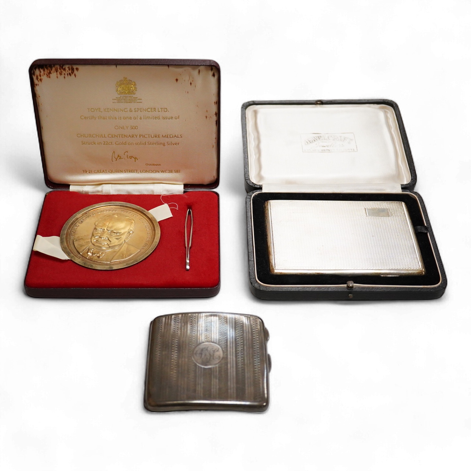 A cased engine turned sterling cigarette case, 11.4cm, a George V silver cigarette case and a cased commemorative limited edition silver gilt Churchill Centenary Picture Medal.